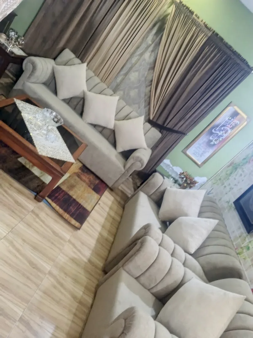 Beige fluted L-shaped sofa in a lounge
