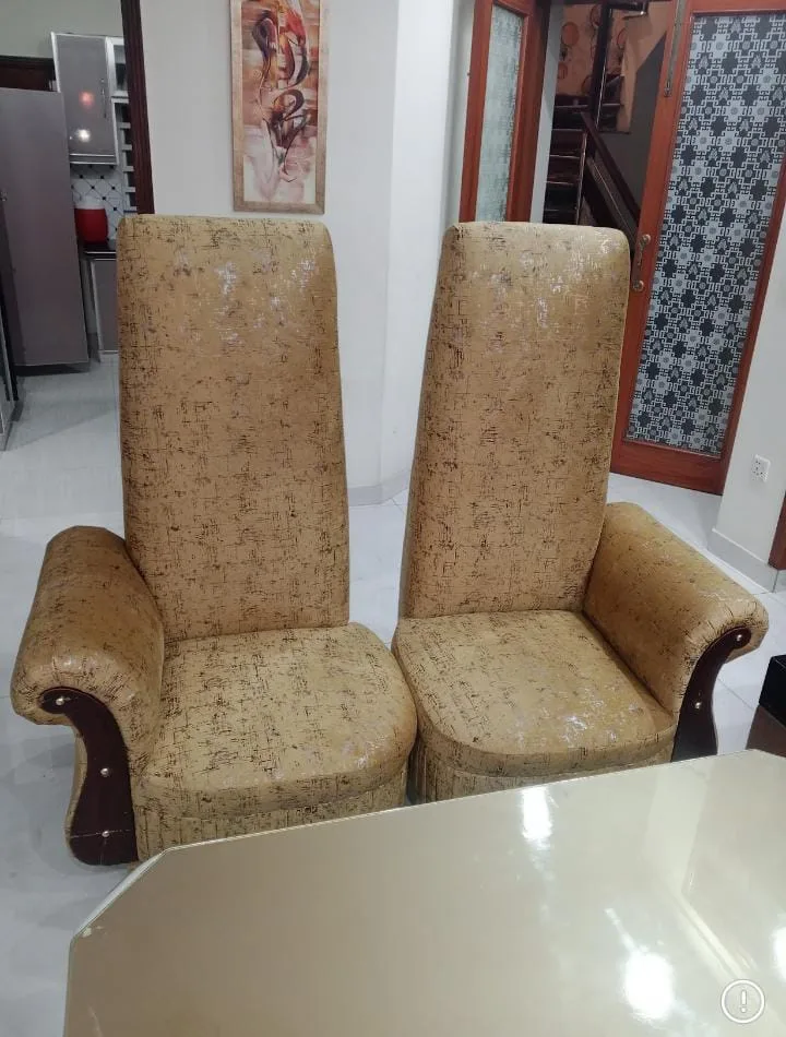 Pair of beige high-back chairs